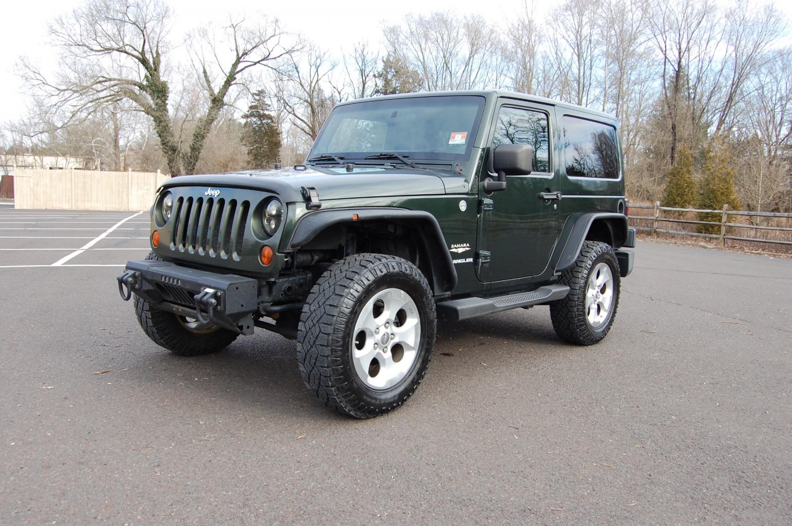 2011 Green /Tan leather Jeep Wrangler Sahara 4WD (1J4AA5D10BL) with an 3.8L V6 OHV 12V engine, 6 Speed Manual transmission, located at 6528 Lower York Road, New Hope, PA, 18938, (215) 862-9555, 40.358707, -74.977882 - Here we have a nice running and driving Jeep Wrangler with a 3.8L V6 putting power to a 4x4 manual transmission. Options include Tan leather, AC, heat, heated front seats, power windows/locks/mirrors, AM/FM/SAT/DISC/AUX radio, cruise control, tilt steering wheel, auto headlights, 3 piece removable h - Photo#0